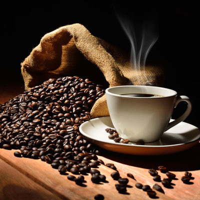 Coffee is a hot beverage made from the coffee bean. This bean is actually a seed that comes from the bright, red cherries of the Coffea tree or shrub.