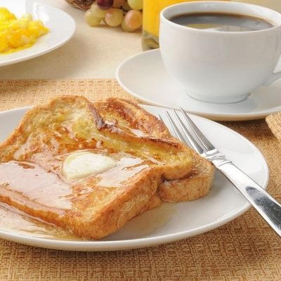 French toast is an age-old recipe that involves dipping bread in an egg-and-milk mixture then pan frying it.