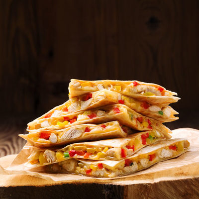 Quesadilla is a griddle-cooked stuffed tortilla that comes from Mexico
