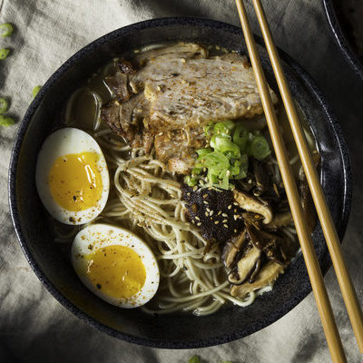 Ramen is a Japanese noodle soup served with a rich combination of flavorful broth, mix of meats and vegetables, and topped with a boiled egg.