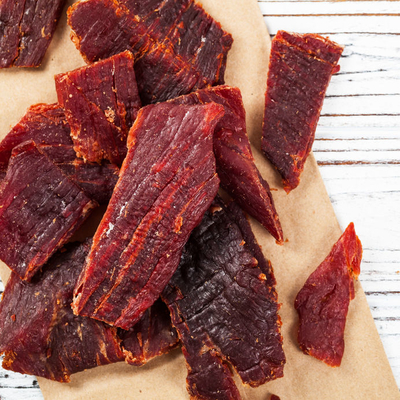 Jerky is a meat that has been cut into strips, cooked, and dehydrated in order to prevent spoilage.