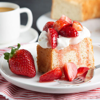 Angel food cake is a type of low-fat cake made with egg whites, flour, sugar, and cream of tartar. The cake is a sponge cake which uses no butter, differentiating it from most other cakes.