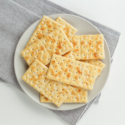 Crackers are flat baked goods made from flour, water, salt, sugar, and oil