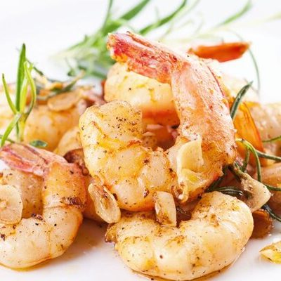 Shrimp are crustaceans with long bodies, tails, slender legs, and whiskers that belong to the Decapoda family.