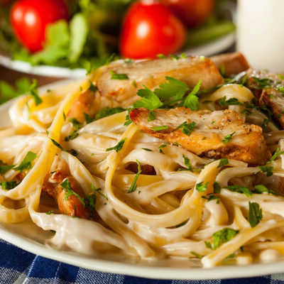 Fettuccine is a type of pasta that is shaped into long ribbons.