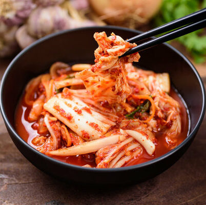 Kimchi juice is a by-product of the fermentation process while making kimchi, which is made from fermented vegetables, fish sauce, and a mix of spices.