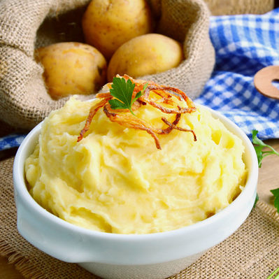 Mashed potatoes are a hot dish made from peeled, sliced, boiled, and pureed potatoes.