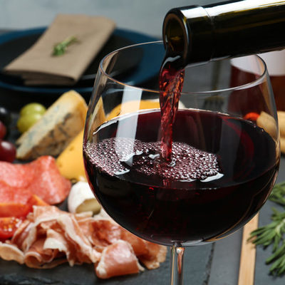 Wine is an alcoholic drink that is usually made from red or white fermented grapes.