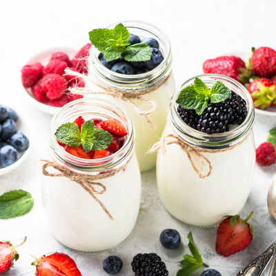 Found in the refrigerated case, yogurt is a food product made from fermenting milk with live bacteria.
