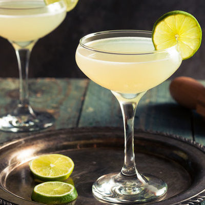 A daiquiri is a cocktail made with white rum, freshly squeezed lime or lemon juice, and a sweetener such as sugar.