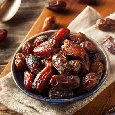 Dates are the edible fruit of the date palm tree, where they grow in clusters.