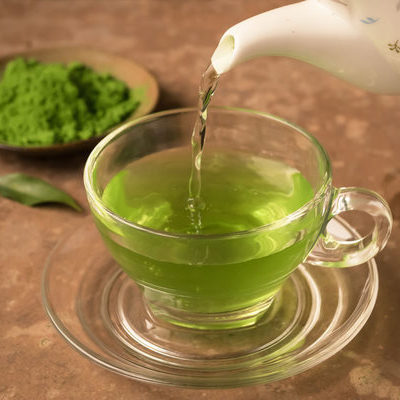 Green tea is a beverage that is prepared by boiling tea leaves in hot water.