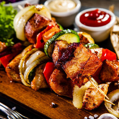 Kebabs refer to dishes that are made of pieces of ground meat or fish and vegetables roasted on a skewer.