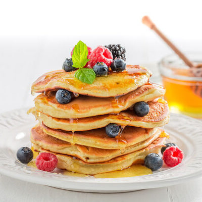 Pancakes are flat and round breakfast food that is made from a batter of flour, eggs, milk, and butter.