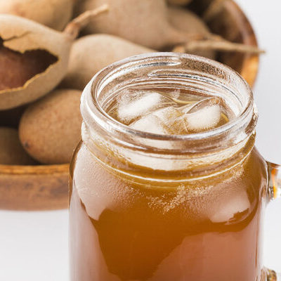 Tamarind juice is a juice extracted from the tamarind fruit, which is a brown, sweet and sour fruit pod.