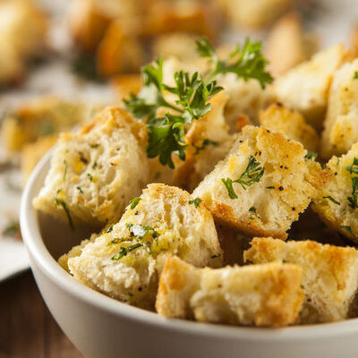 Croutons are small, cubed, seasoned pieces of bread that can be sauteed, baked or fried.