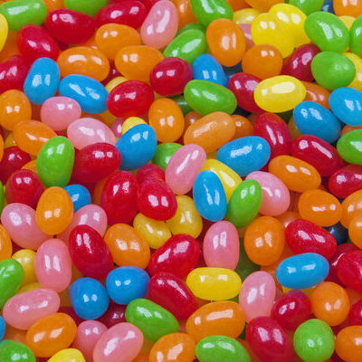 Jelly beans are small bean-shaped candies that have a soft and gummy interior and a hard exterior.