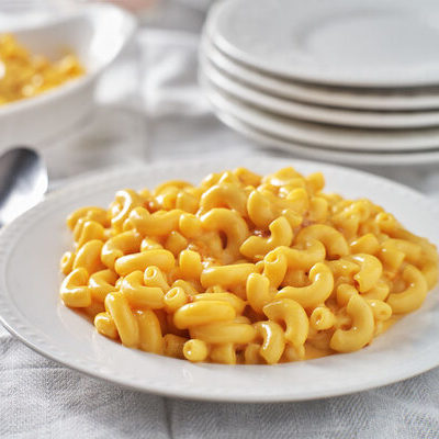 Macaroni and cheese is a dish primarily made up of a cheddar cheese sauce and macaroni pasta.