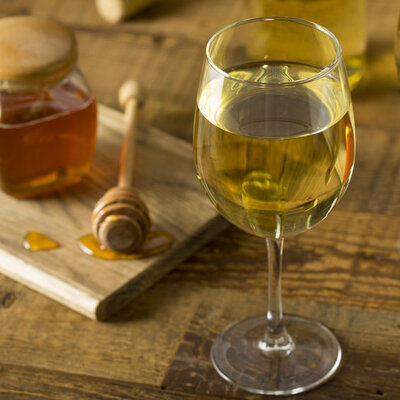 Mead is an alcoholic beverage made by fermenting honey with water.