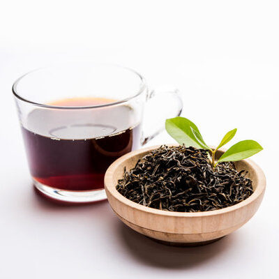 Black tea is a beverage that is prepared by boiling tea leaves in hot water.