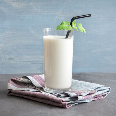 Lassi is a yogurt-based drink that has its origin in India and typically contains yogurt, spices, fruits, and water.