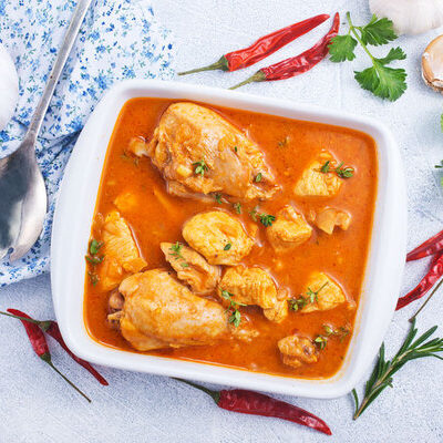 Red curry is a food of Thai origin that consists of red curry paste cooked with coconut milk and other additional spices.