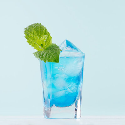 Blue Curaçao is a liqueur made with the dried peel of the laraha fruit.