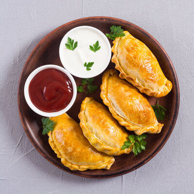 Empanadas are a type of pastry filled with savory ingredients then deep fried or baked.