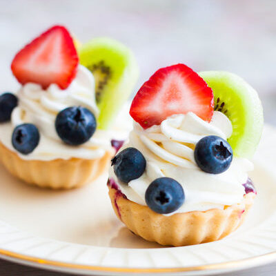 A fruit tart is a dish that has a sweet and firm pastry crust, vanilla pastry cream filling, fresh fruits, and a fruit glaze.