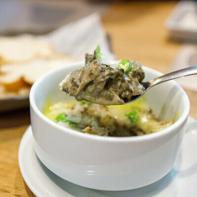 Laing is a Filipino dish made with pork, taro leaves, and coconut milk in the form of a stew.