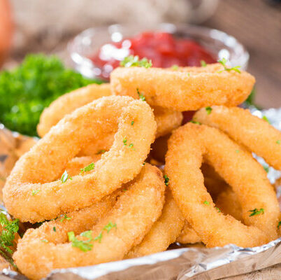 Onion rings are a British dish consisting of onions cut cross-sectionally into rings, breaded with flour, milk, and eggs, and then batter-fried.