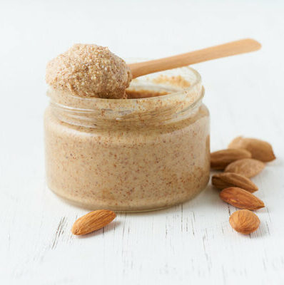Almond butter is a nut butter made by grinding almonds into a creamy paste.