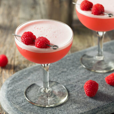 A Clover Club is a cocktail of American origin. The base spirit in the cocktail is gin, and other ingredients are lemon juice and raspberry syrup.