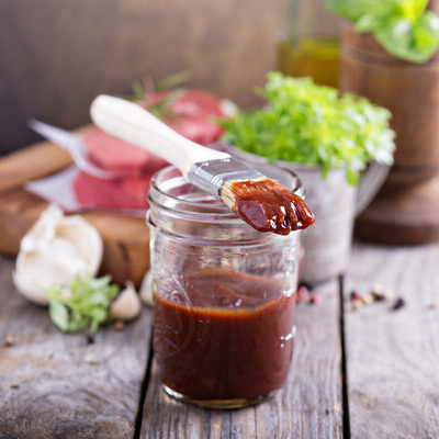 Barbecue sauce is an American sauce made of different ingredients, including vinegar, tomato paste, mayonnaise, onion powder, mustard, black pepper, chili powder, paprika, and sugar.