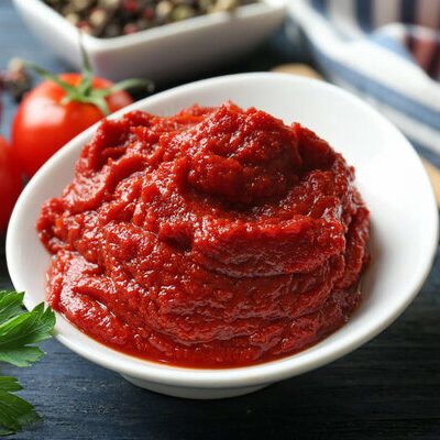 Tomato paste is a concentrated, thick paste made from cooked tomatoes. It has an intense tomato flavor and is used to flavor different dishes.