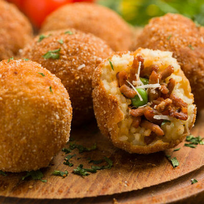 The arancino is an Italian dish. Arancini consist of rice balls cooked in broth, stuffed with different ingredients such as cheese, meat, and vegetables, and then deep fried.