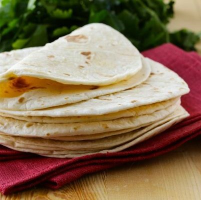 The tortilla is a flatbread of Mexican origin. It is an unleavened bread, traditionally made from corn meal, though nowadays wheat varieties are also available.
