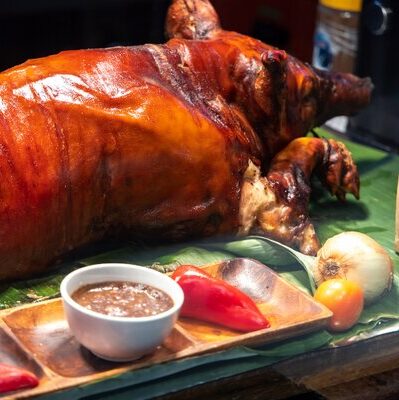 Lechon is a Filipino dish that consists of a suckling pig roast. It is stuffed with spices like aniseed, herbs, and seasonings, and slow roasted on an open fire spit.