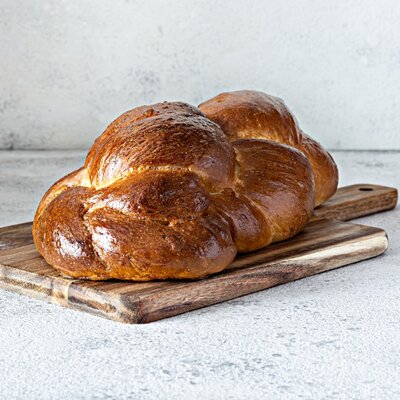 Challah is a type of egg bread specifically associated with the Jewish religion. It is of Ashkenazi Jewish origin and is often consumed on the Shabbat (Saturday) and Jewish festivals.